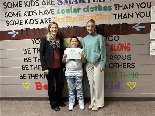 Luis Sustache, McKinley's Stairclimber for December, poses with his award plaque.